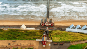 The classic Saltburn tram surrounded by greenery and nature.
